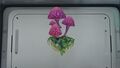 A Plant Shelf with a Pink Mushroom
