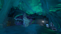 A carved out chamber with an exposed portion of the Frozen Leviathan's head