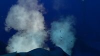 Lava geysers creating pillars of steam at the very bottom of the biome