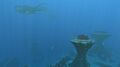 A view of the Grassy Plateaus, featuring a pod of Reefbacks from afar