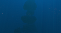 A towering rock formation bordering the Grand Reef