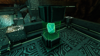 A emerald contained within a specimen case