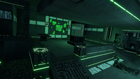 A room in the Disease Research Facility with a tank and two desks
