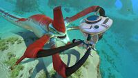 The Prawn Suit grabbed by a Reaper Leviathan seen from outside.