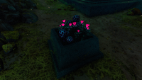 Speckled Rattlers growing alongside a few Voxel Shrubs atop a pedestal.